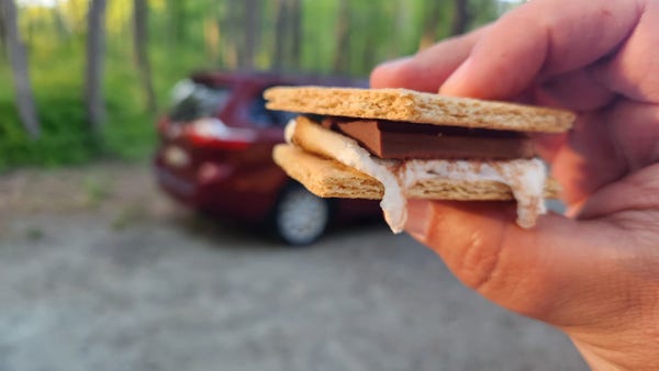 A freshly made s'more by the campfire