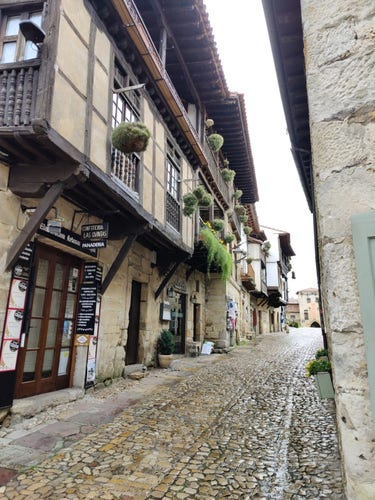 A narrow cobbled mediaeval street in northern Spain with olde worldly shops