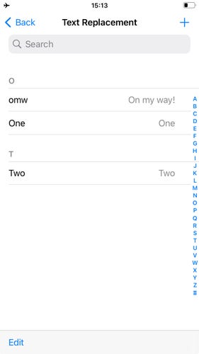 Screenshot of the Keyboard Text Replacement view on iOS. The view shows the list of added text replacement shortcuts.