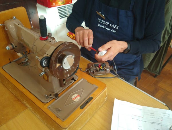 A sewing machine being repaired by one of our volunteers at a previous Repair Cafe event.