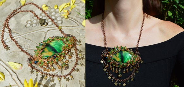 A large Eye necklace in golden yellow and green. The central stone is Tiger Eye dyed green and yellow, and has a black line forming the pupil. It has a metallic sheen. Beads and curls of wire form the eye lashes, and hang below as a fringe of "tears". The left photo shows it lying on a white table, with a thick copper chain of round links. Yellow flower petals scvattered around. The right photo shows it being worn by a person in a black dress. The Eye is quite large, about 3 inches across. Below it hangs a fringe of beads, and a looped chain of more beads and tiny stars.