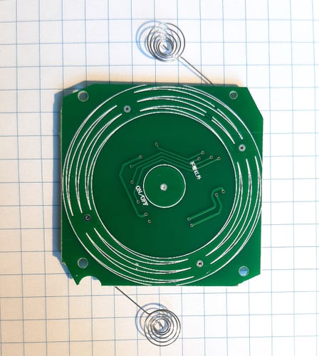 ON/OFF button label with mysterious Chinese characters on a green PCB