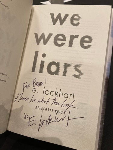Title page of We Were Liars, signed by the author E. Lockhart with “Please lie about this book.”