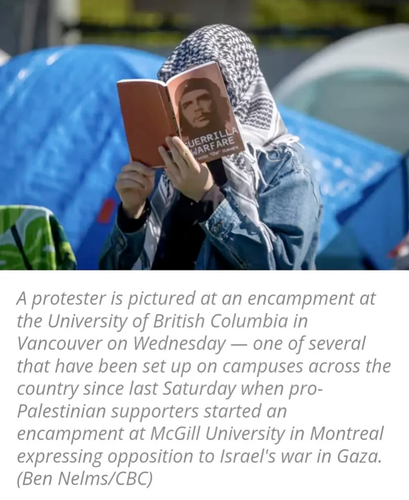 A protester reads at a pro-Palestinian encampment at the University of British Columbia's Point Grey campus in Vancouver on Thursday. (Ben Nelms/CBC)