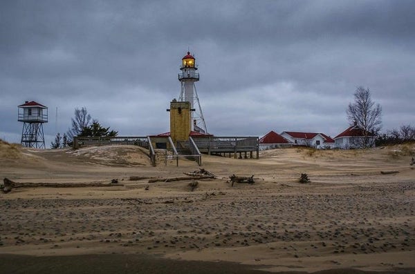 The iconic Whitefish Point Lighthouse captured on a subdued winter day, its light a promise of warmth. Image at:  https://beautifulsunphotography.com/featured/whitefish-point-light-from-the-beach-deb-beausoleil.html See more art & blog at: https://beautifulsunphotography.com/ https://debbeautifulsunphotography.com/ https://www.zazzle.com/store/beautifulsun_designs https://debbeausoleil.com
