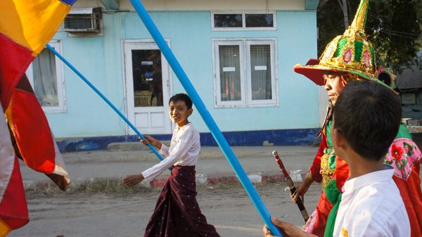 a digital photo of a buddhist procession in myanmar