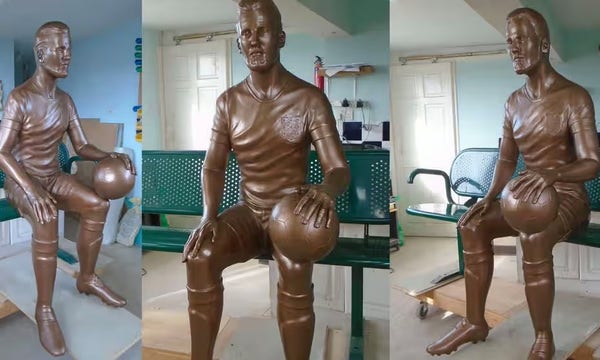 3 views of a bronze statue of a footballer, seated on a metal park bench, holding a football. It’s meant to be Harry Kane, but this is perhaps not immediately obvious