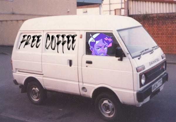 A white van with the words "FREE COFFEE" written on the side and an image of a cartoon face on the window.