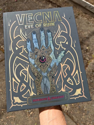 I’m holding the Vecna Eve of Ruin book so the hand on the cover lines up with my arm holding it from below. 