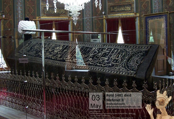 The picture shows a wooden coffin (empty)