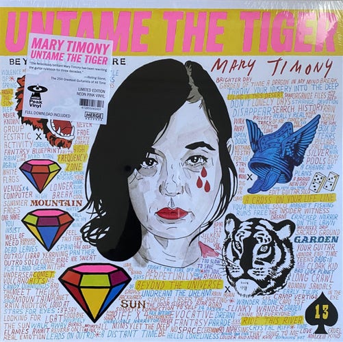An illustration of Mary Timony framed in a field of handwritten text appears on the cover of the album Untame the Tiger. 
