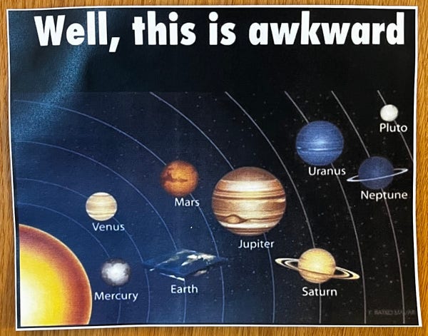 An illustration of the solar system with the Sun, planets, and Pluto labeled, with the caption "Well, this is awkward" at the top because the Earth is flat whereas the other celestial bodies are spherical.