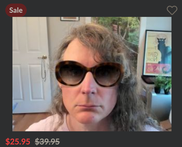 a screenshot of me using the virtual try on to put on a pair of very oval tortoise-shell sunglasses that look like the kind female movie stars wear in movies to not be recognized in public.