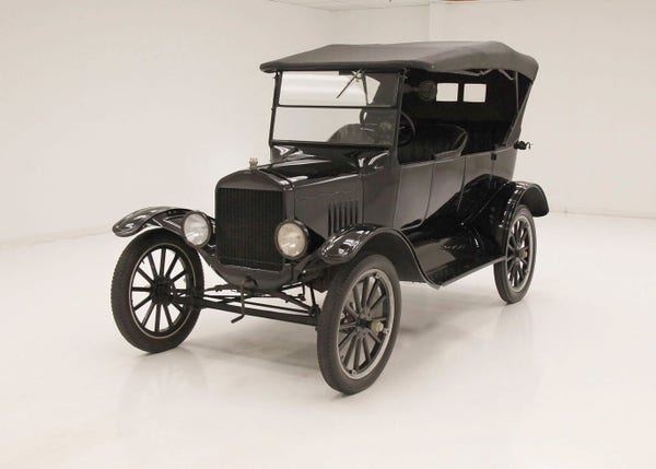 A photograph of a black, Ford Model T vehicle.