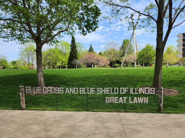 Blue cross and blue shield of Illinois, great lawn, a sign in a park 