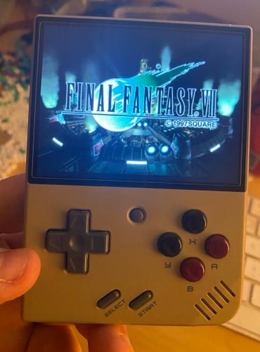 The Miyoo mini plus playing Final Fantasy 7 on PSOne. The logo for the game is showing on the screen 