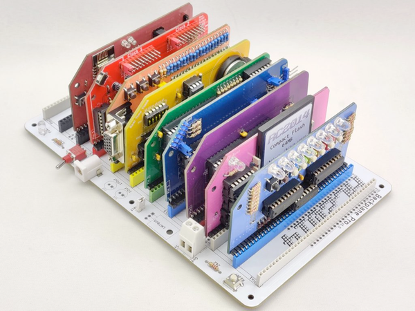 Limited Edition RC2014 Zed Pro Pride Z80 CPU kit, with a series of PCB cards of different types and functions all plugged into a backplane, each card a different color of the rainbow. 

Colors of each card: I’m gonna call that burnt orange/red "Sienna"… Red, Orange, Yellow, Green, Blue, Purple, Pink, and kind of a light Periwinkle / light blue, and the backplane is white. 