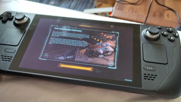 Photo of a portable SteamDeck showing a Shadowrunner loading screen.