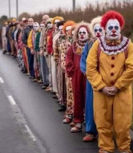Creepy clowns standing in a line.