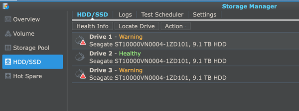 a screenshot from the HDD / SSD page of our Synology's Storage Manager. 2 of the 3 drives in our raid are marked with warnings. 
