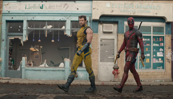 Screencap from Deadpool and Wolverine with the two walking in front of damaged businesses