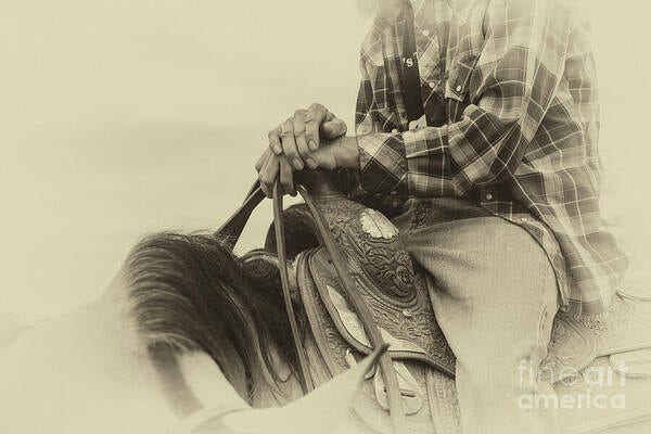 Sepia toned photo of a horse trainer sitting on his horse
