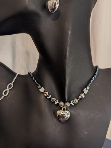Necklace with silver heart, silver round and arrow beads and dark blue glass beads 
Infinity symbol zircon adjustable bracelet