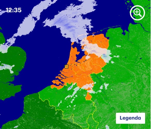 A weather map of The Netherlands from Buienradar, showing the country in orange as is traditional on this day each year. The surrounding countries are green, the sea is blue, and there are some rain clouds in light blue to the north.