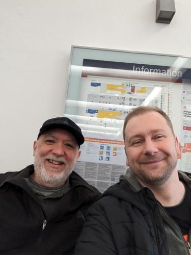 Jürgen and Luciano in the waiting hall of the train station in Regensburg, on their way to Berlin for PyConDE.