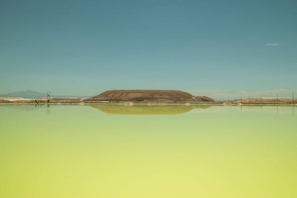 A brine pool at an SQM lithium mine on the Atacama salt flat in the Atacama Desert, Chile. The industry that deals with one of the world’s most important commodities is asking whether it's doomed to repeat a boom and bust cycle again and again. | BLOOMBERG

