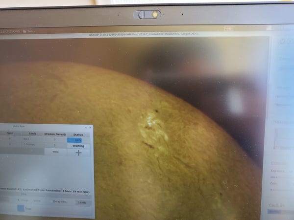 Picture of a laptop screen showing the surface of the sun in high resolution