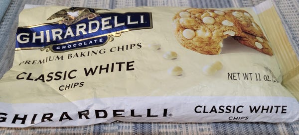 a photo of the package, with the "Ghirardelli Chocolate" logo above "Premium Baking Chips" and then "Classic White Chips"