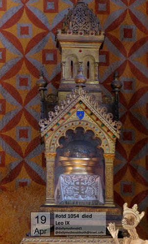 The picture shows a reliquary in the form of a church building