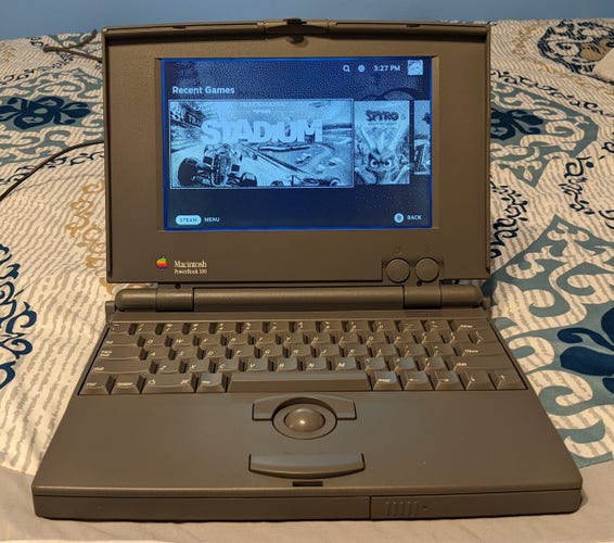 A Macintosh PowerBook 100, displaying the Recent Games section of SteamOS.