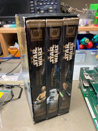 The original Star Wars trilogy on VHS tapes in a cardboard slipcase. It’s the German Widescreen Edition (original, without the computer effects they added later).